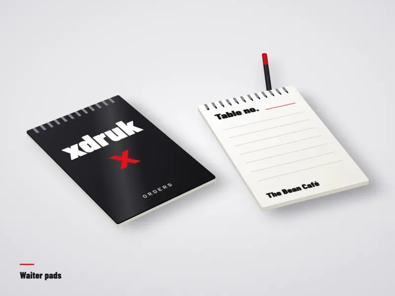 Glued waiter order pad with a restaurant logo and a table number field