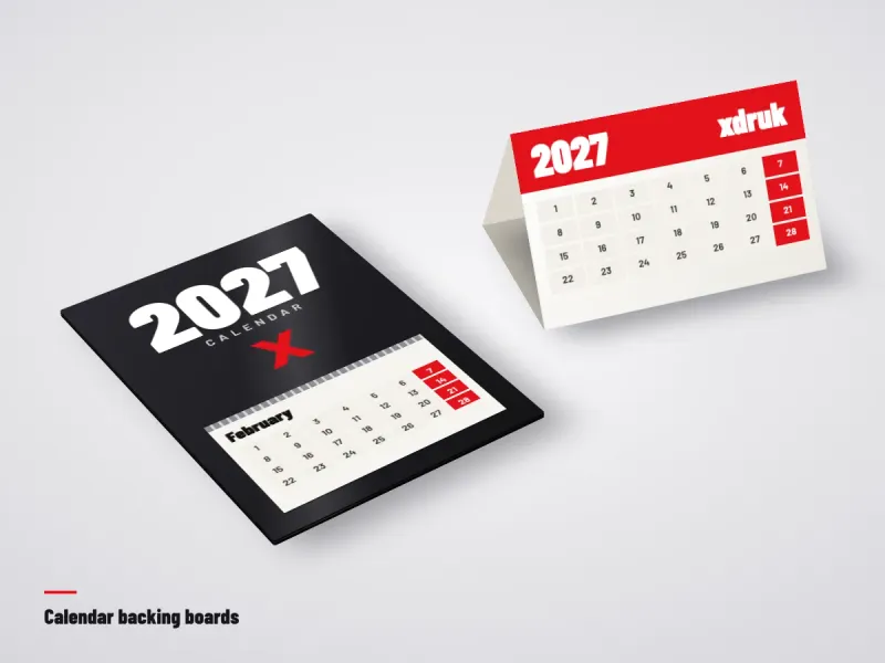Printed 3-month calendar backing board next to a board desk tent